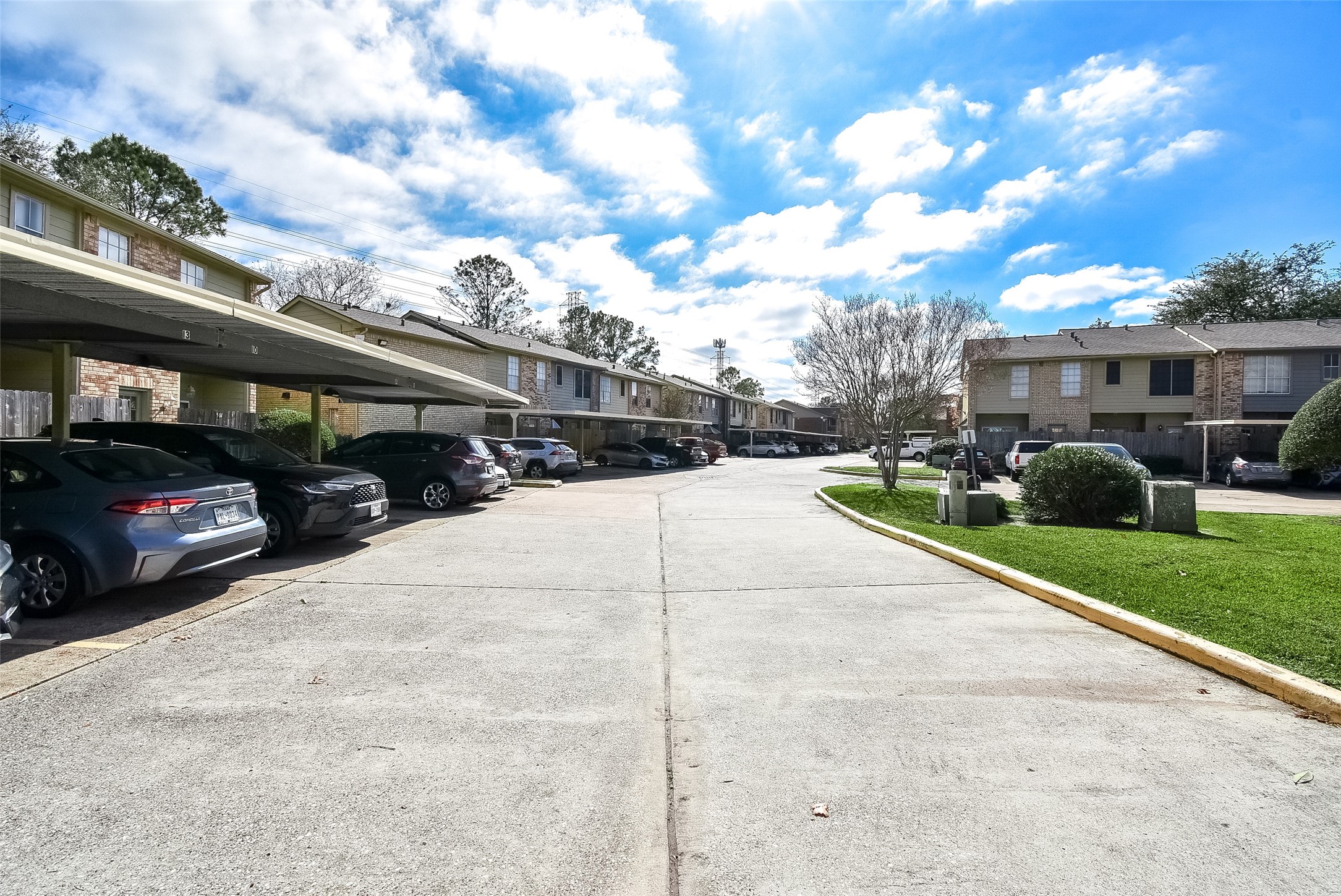 1515 Sandy Springs Road, Unit 1006 Houston, TX 77042 - Photo 35 of 35 a street view with cars parked