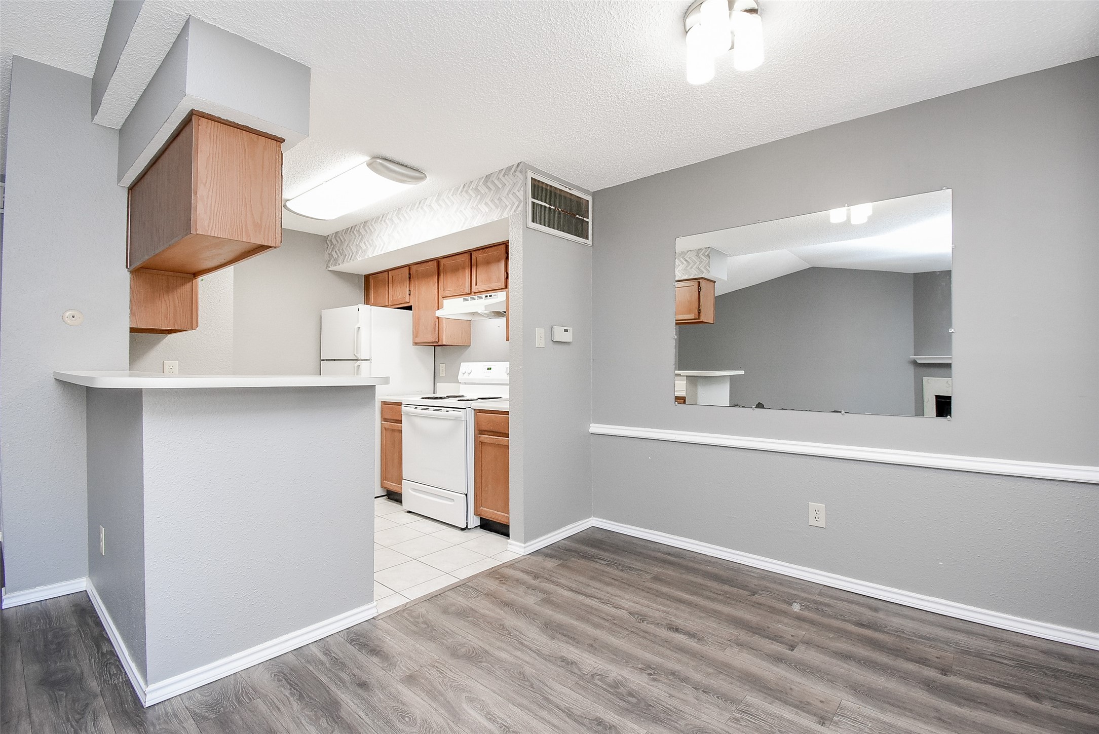1515 Sandy Springs Road, Unit 1006 Houston, TX 77042 - Photo 5 of 35 a view of kitchen with wooden floor
