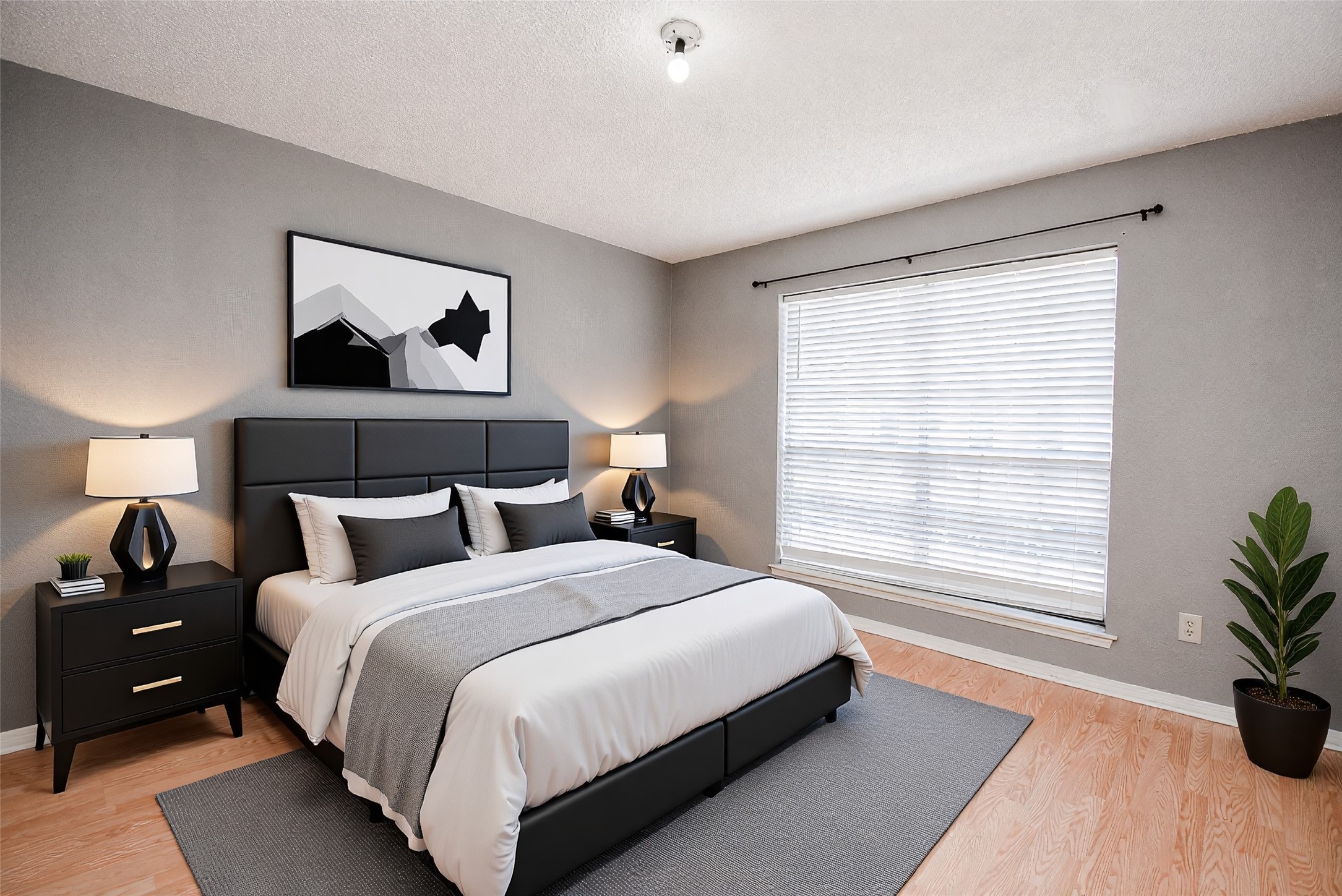 1515 Sandy Springs Road, Unit 1006 Houston, TX 77042 - Photo 10 of 35 a bedroom with a bed and a potted plant