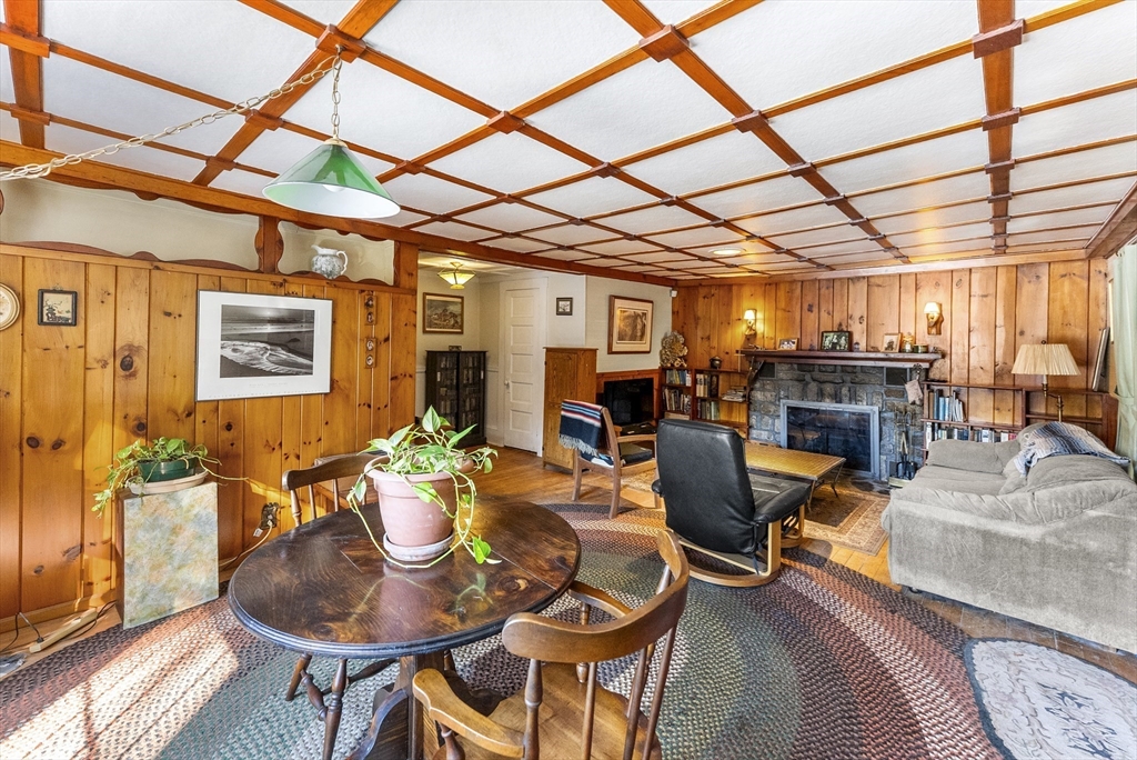 115 Kennedy Road Stoughton, MA 02072 - Photo 14 of 42 a dining room with furniture a chandelier and wooden floor