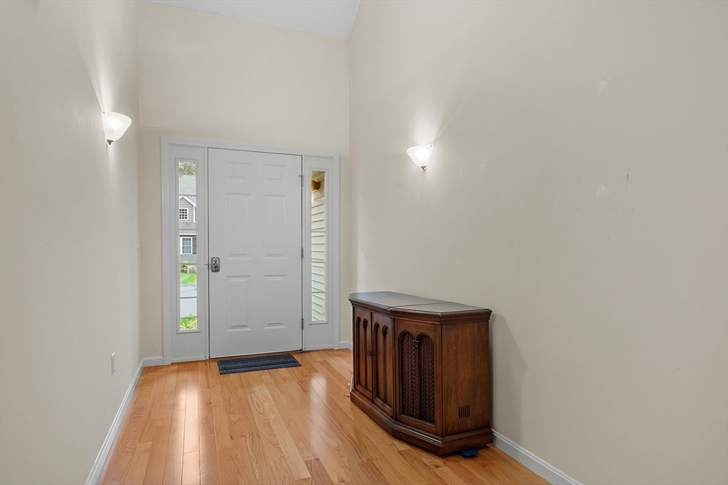 2 Riley Road, Unit C Lunenburg, MA 01462 - Photo 11 of 42 a view of an empty room with wooden floor and a window