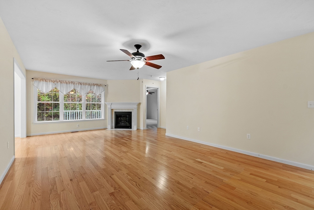 2 Riley Road, Unit C Lunenburg, MA 01462 - Photo 12 of 42 a view of an empty room with wooden floor and a window