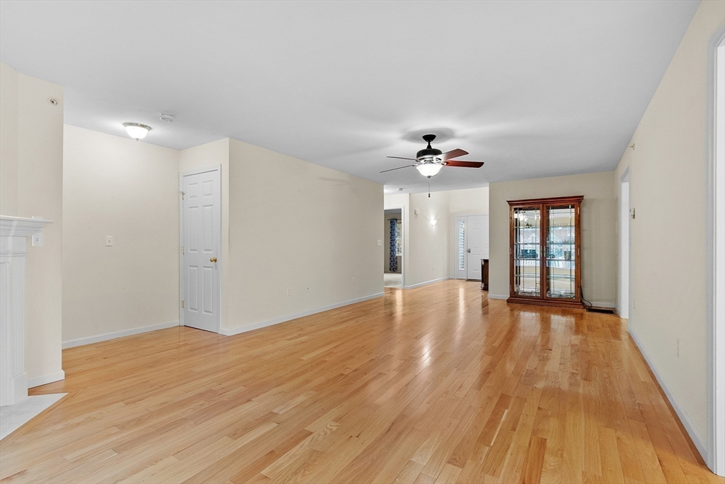 2 Riley Road, Unit C Lunenburg, MA 01462 - Photo 13 of 42 a view of an empty room with wooden floor and a window