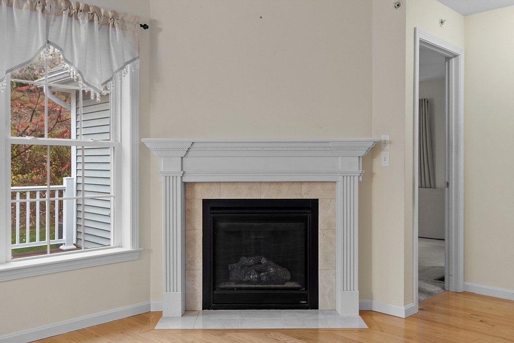 2 Riley Road, Unit C Lunenburg, MA 01462 - Photo 17 of 42 a white building with a fireplace