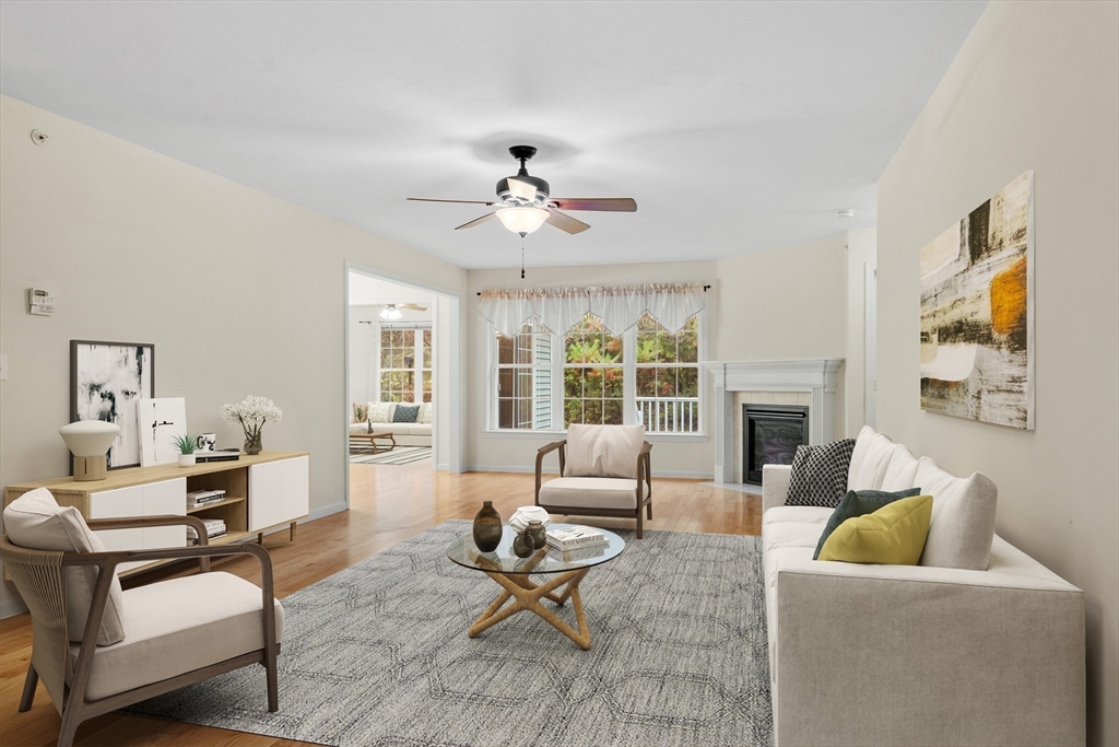 2 Riley Road, Unit C Lunenburg, MA 01462 - Photo 2 of 42 a living room with furniture and a fireplace
