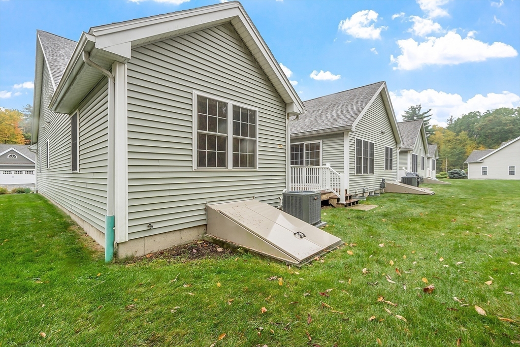 2 Riley Road, Unit C Lunenburg, MA 01462 - Photo 36 of 42 a backyard of a house with table and chairs