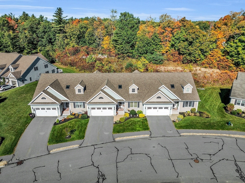 2 Riley Road, Unit C Lunenburg, MA 01462 - Photo 39 of 42 an aerial view of a house with a yard and large trees