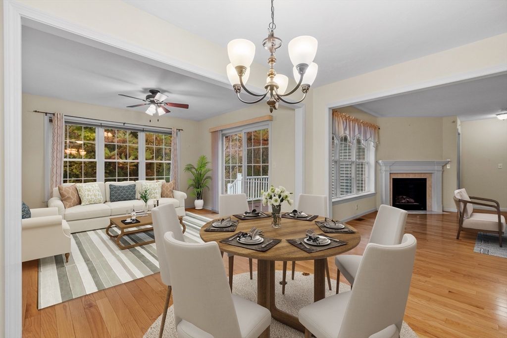 2 Riley Road, Unit C Lunenburg, MA 01462 - Photo 4 of 42 a view of a dining room with furniture wooden floor and chandelier