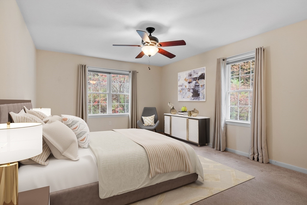 2 Riley Road, Unit C Lunenburg, MA 01462 - Photo 5 of 42 a bedroom with a bed and a chandelier