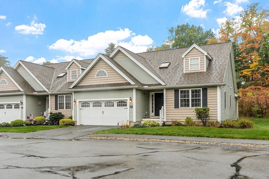 2 Riley Road, Unit C Lunenburg, MA 01462 - Photo 8 of 42 a front view of a house with a yard and a garage