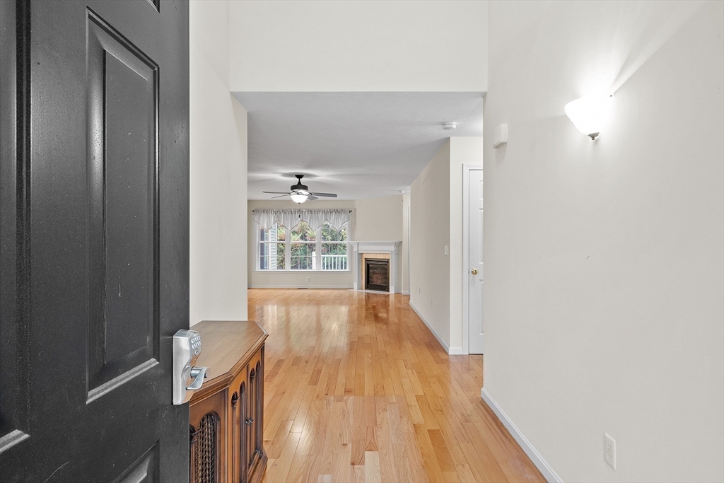 2 Riley Road, Unit C Lunenburg, MA 01462 - Photo 10 of 42 a view of a hallway with wooden floor and a bathroom