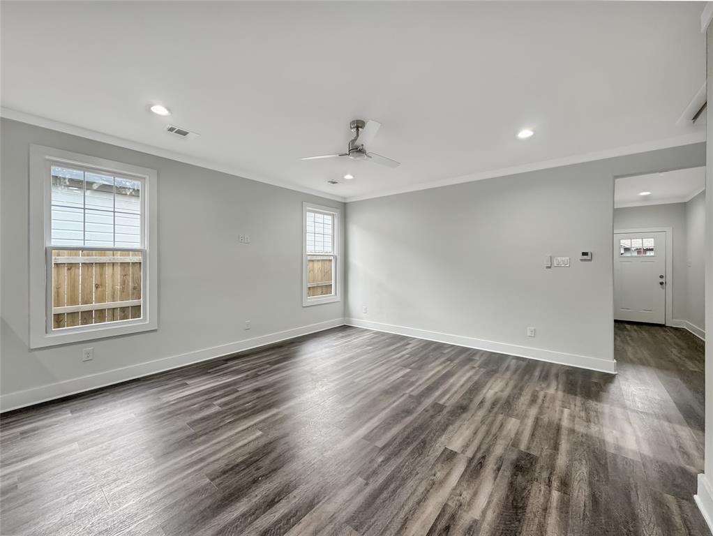 3518 Meadow Street Dallas, TX 75215 - Photo 5 of 20 Empty room featuring crown molding, recessed lighting, dark wood-style floors, and a ceiling fan