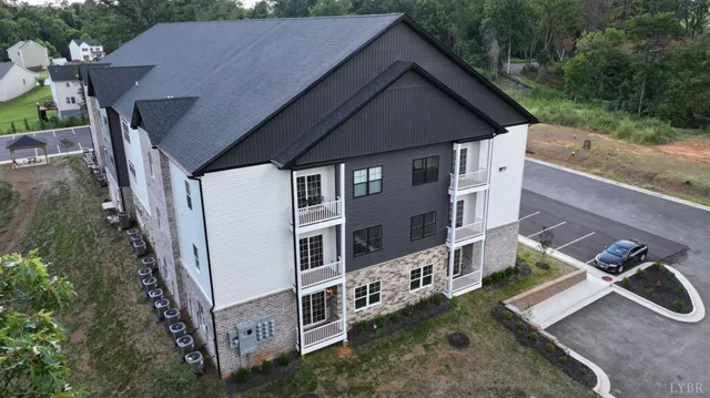 aerial view of a house with a yard