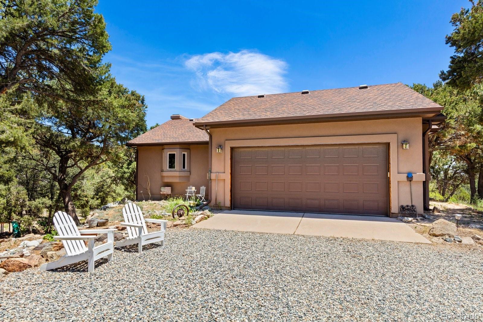 990 Hamilton Creek Road Coaldale, CO 81222 - Photo 41 of 49 a front view of a house with a yard and garage