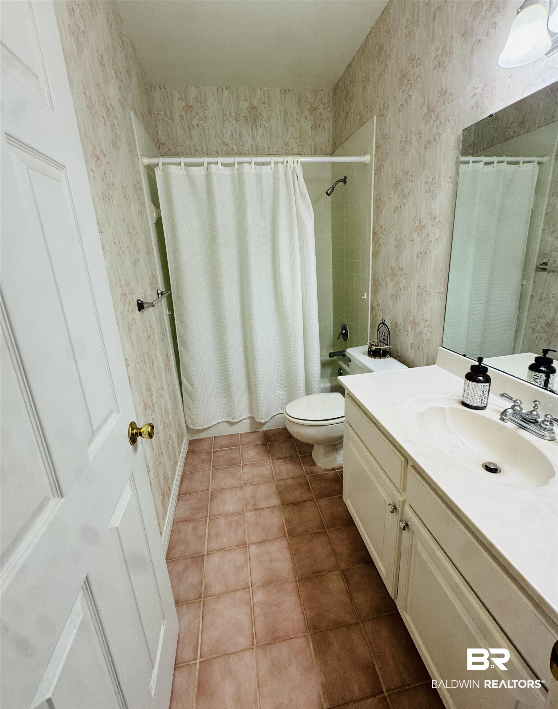 13795 White Road Silverhill, AL 36576 - Photo 54 of 99 Full bath featuring wallpapered walls, vanity, light tile patterned flooring, and shower / bath combo with shower curtain
