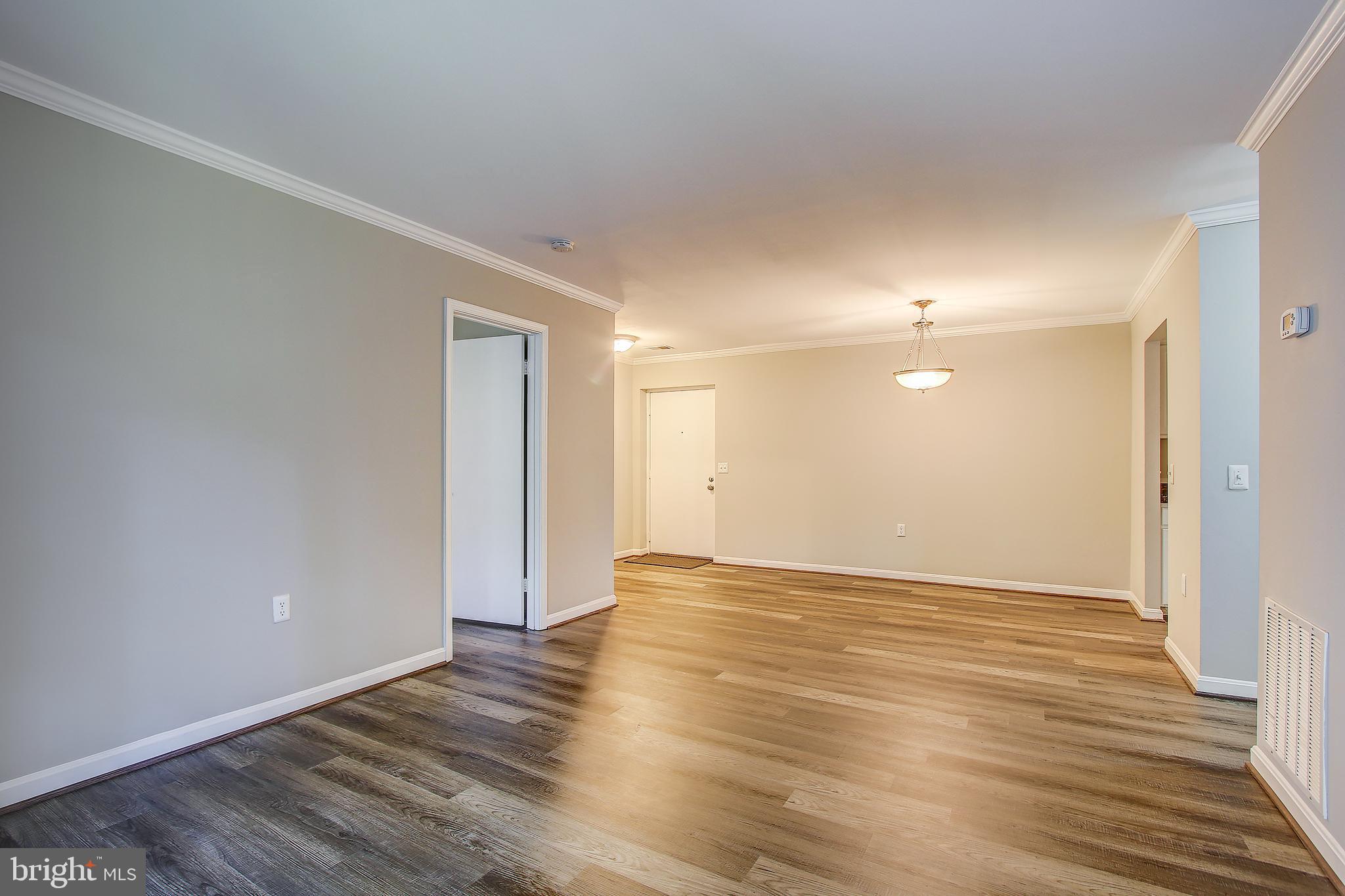 18324 Streamside Drive, Unit 302 Gaithersburg, MD 20879 - Photo 13 of 31 Family Room Opens to Dining Area