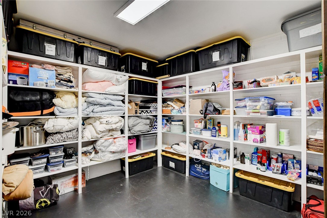 3765 Berkeley Street Logandale, NV 89021 - Photo 63 of 87 A dedicated storage room, thoughtfully organized with ample shelving for household essentials.