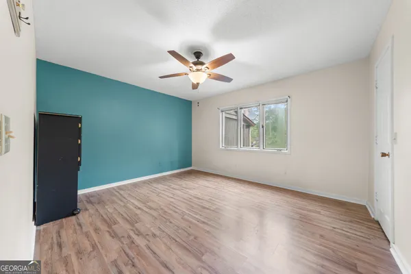 a view of an empty room with a window