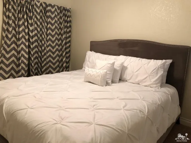 a bathroom with a granite countertop sink a toilet and bathtub