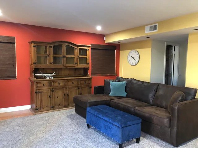 a kitchen with stainless steel appliances granite countertop a stove and a fireplace