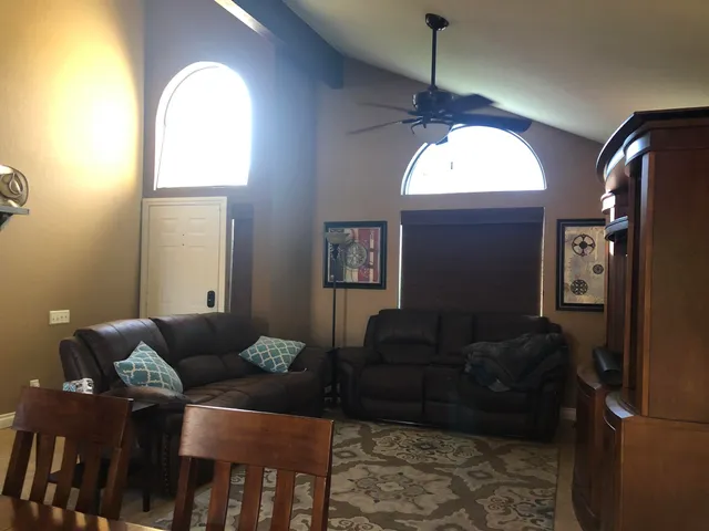 a living room with furniture and a window