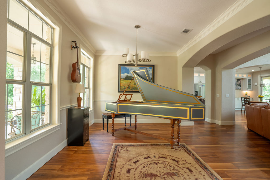 13800 Lone Rider Trail Austin, TX 78738 - Photo 6 of 27 a room with lots of furniture and windows