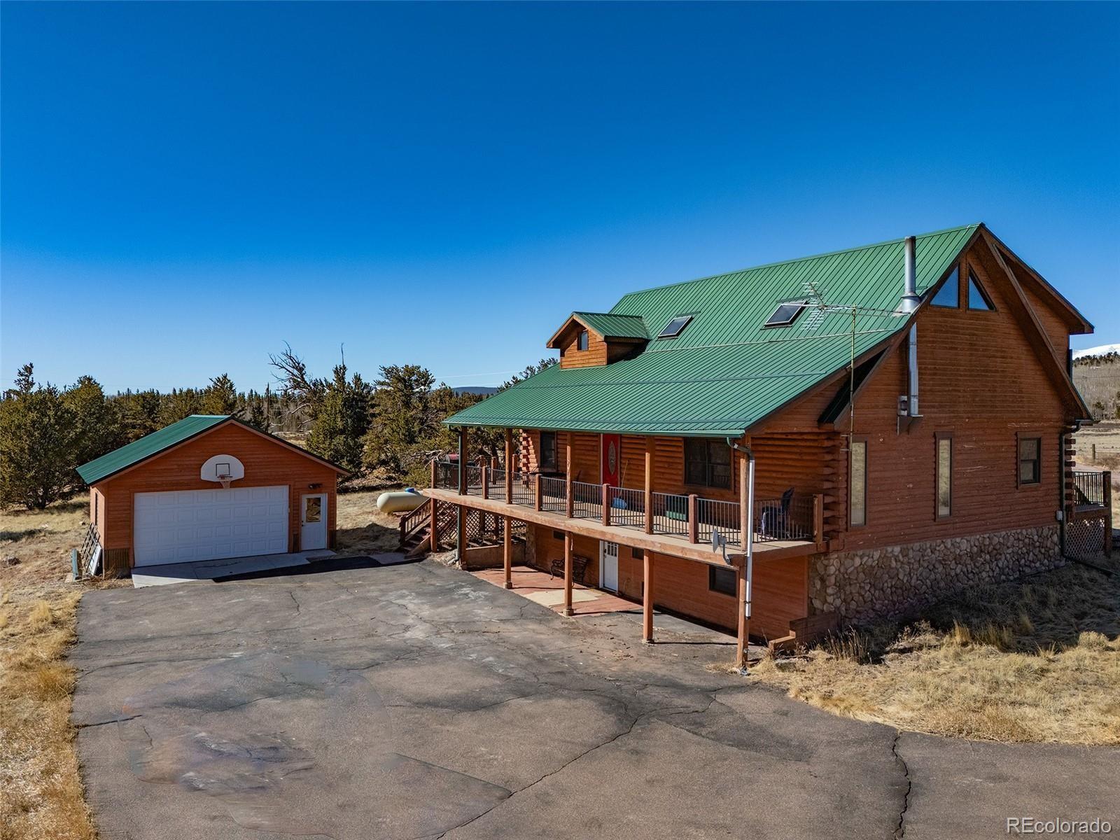 1528 Silver Heels Road Fairplay, CO 80440 - Photo 24 of 50 a front view of a house with a yard