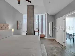 a large bedroom with a large bed and furniture