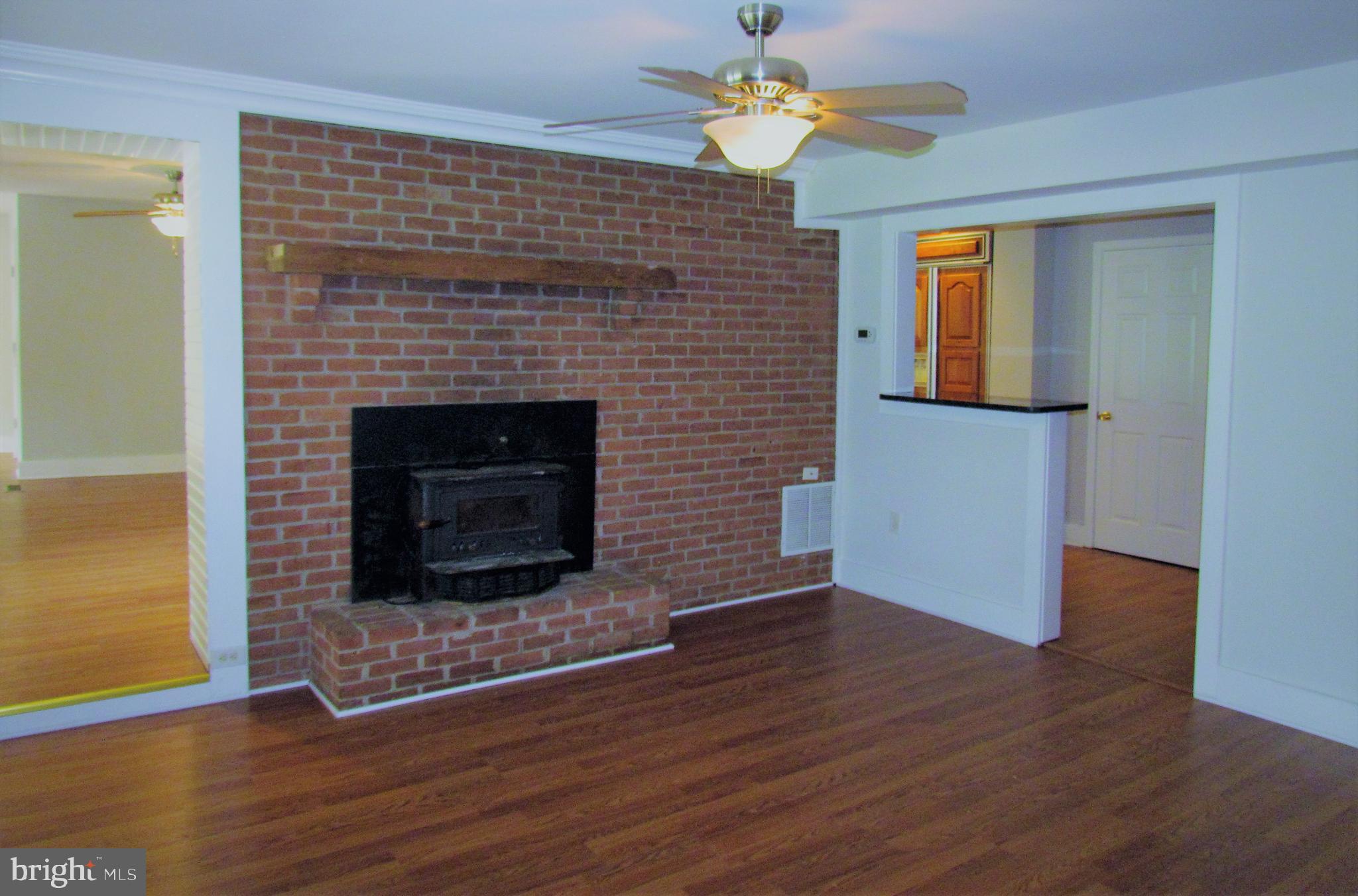 12336 Coppermine Road Union Bridge, MD 21791 - Photo 10 of 37 Fireplace w/ wood stove insert