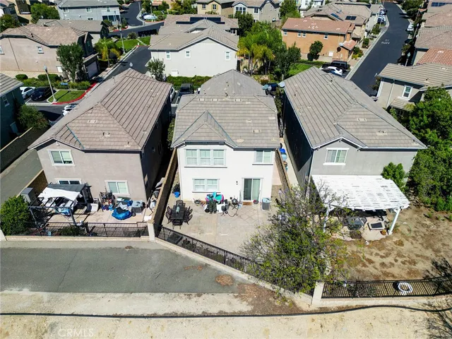 an aerial view of a house with a garden