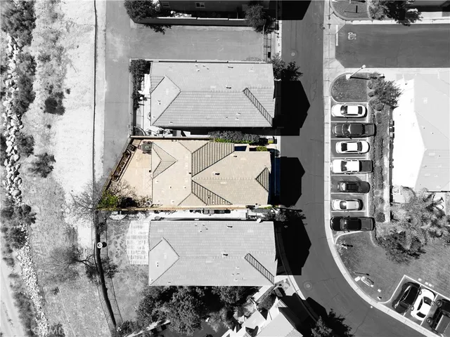 an aerial view of residential houses with outdoor space