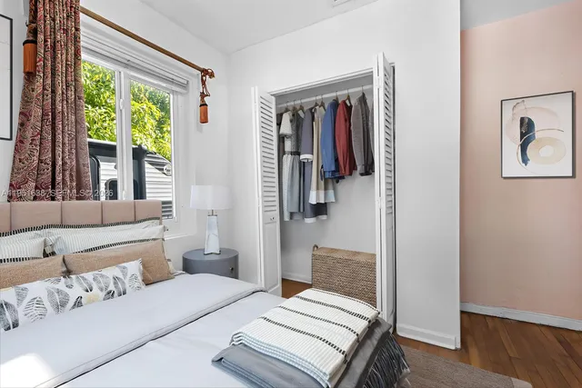 a living room with furniture and large windows