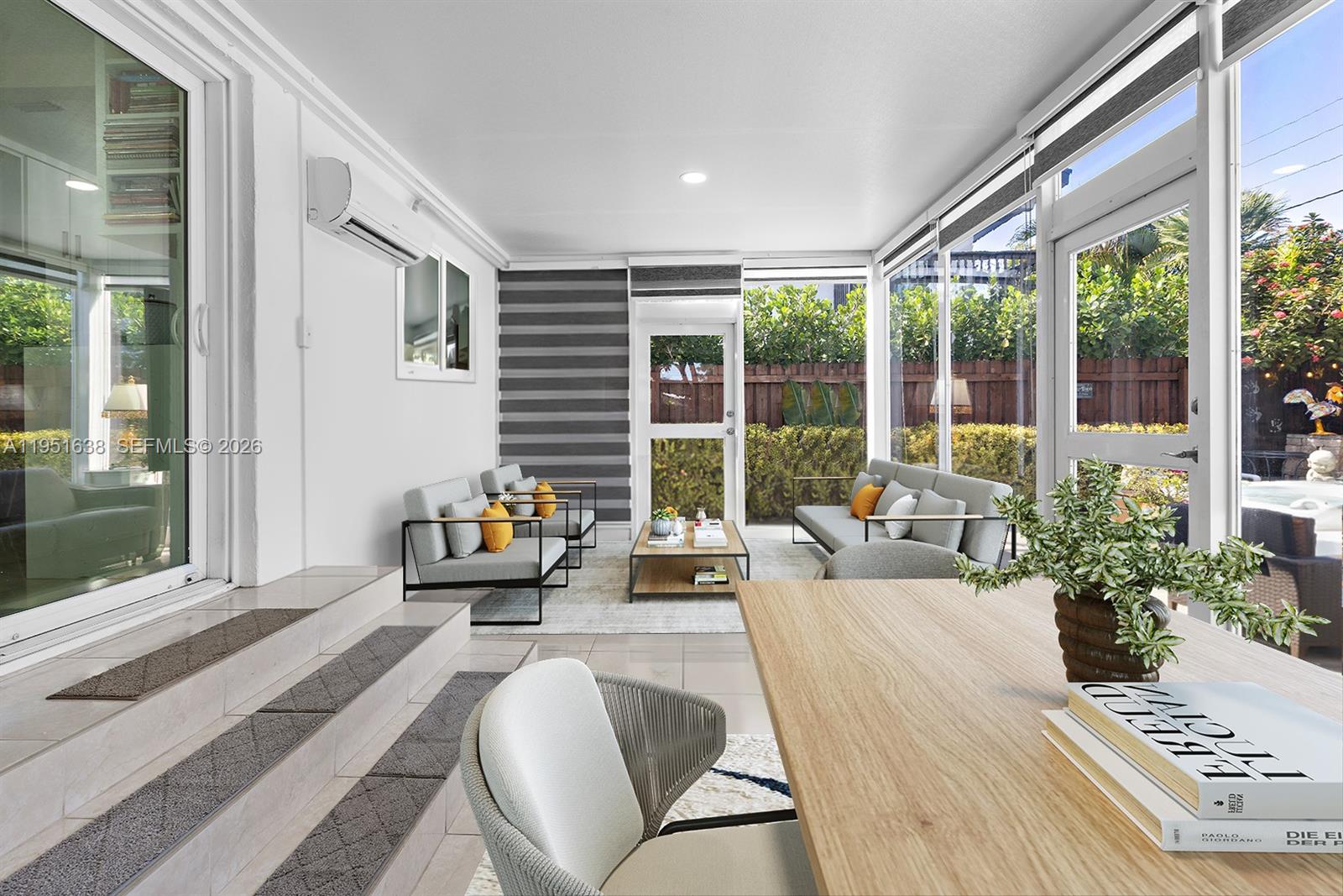 4331 Southwest 7th Street Miami, FL 33134 - Photo 16 of 46 a living room with furniture and large windows