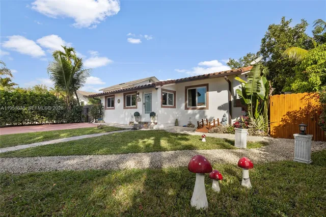 a front view of a house with backyard