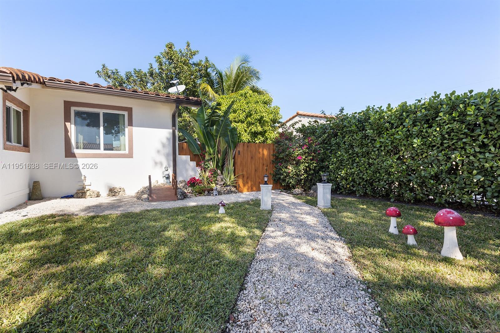 4331 Southwest 7th Street Miami, FL 33134 - Photo 23 of 46 a view of a house with backyard and sitting area
