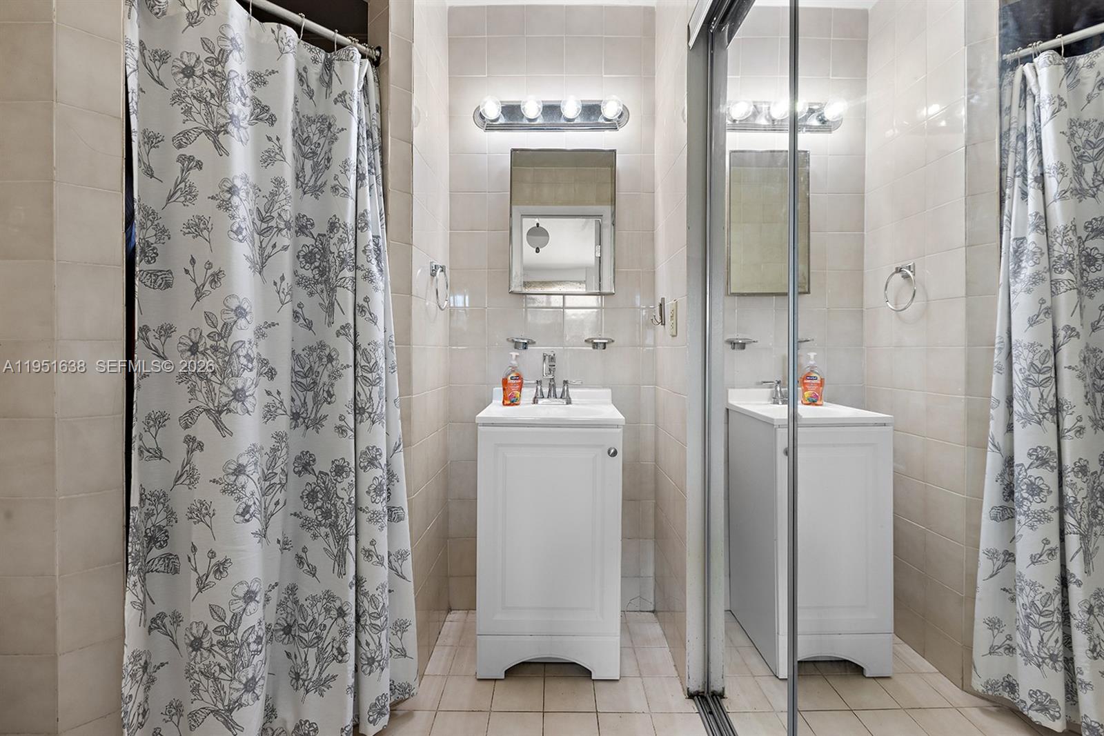 4331 Southwest 7th Street Miami, FL 33134 - Photo 24 of 46 a bathroom with a shower and a sink