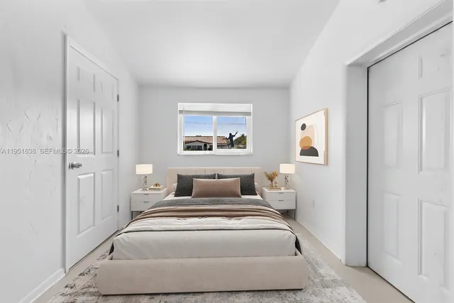 a bedroom with a bed and a couch