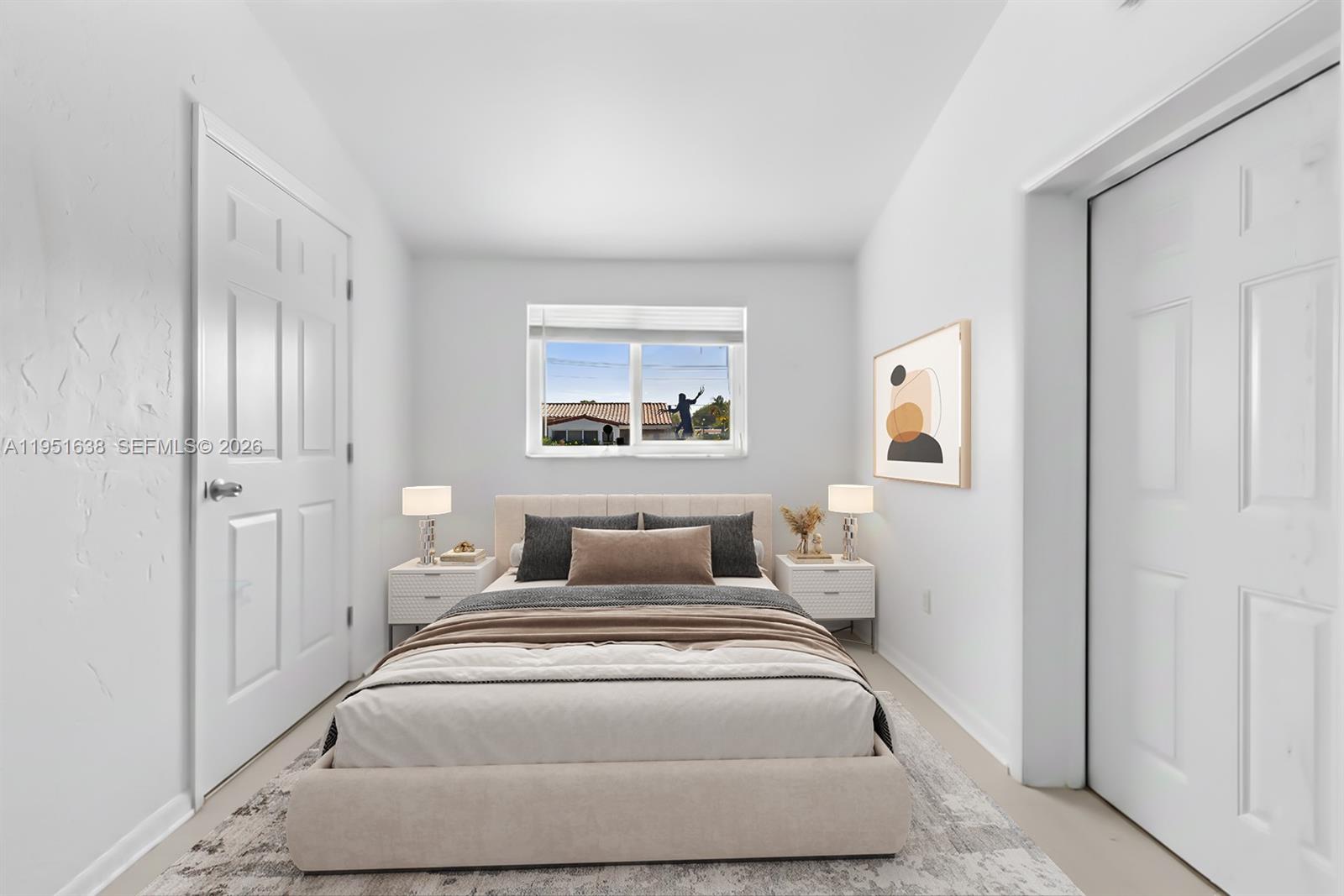 4331 Southwest 7th Street Miami, FL 33134 - Photo 25 of 46 a bedroom with a large bed and a window