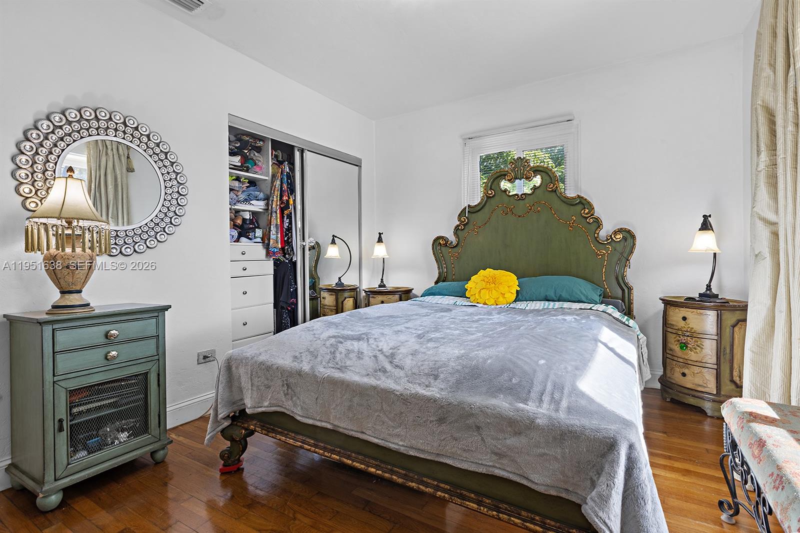 4331 Southwest 7th Street Miami, FL 33134 - Photo 27 of 46 a bedroom with a bed and dresser with mirror