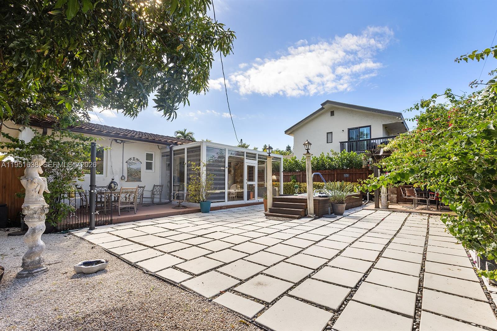 4331 Southwest 7th Street Miami, FL 33134 - Photo 30 of 46 a view of house with backyard outdoor seating and plants