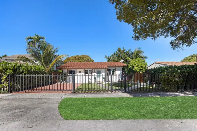 a view of a house with a yard porch and sitting area