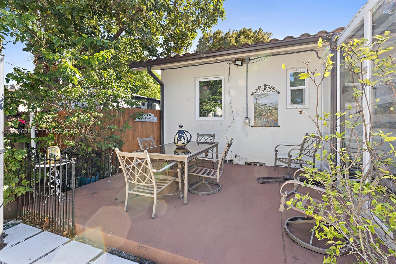 4331 Southwest 7th Street Miami, FL 33134 - Photo 41 of 46 a view of a patio with table and chairs and potted plants