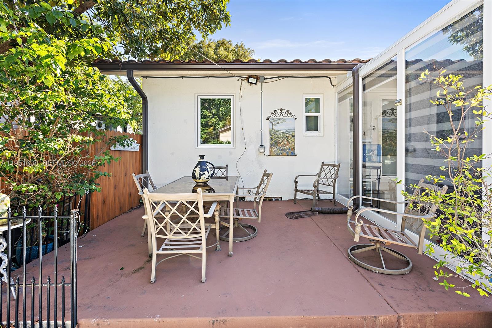 4331 Southwest 7th Street Miami, FL 33134 - Photo 42 of 46 a view of a patio with table and chairs and potted plants