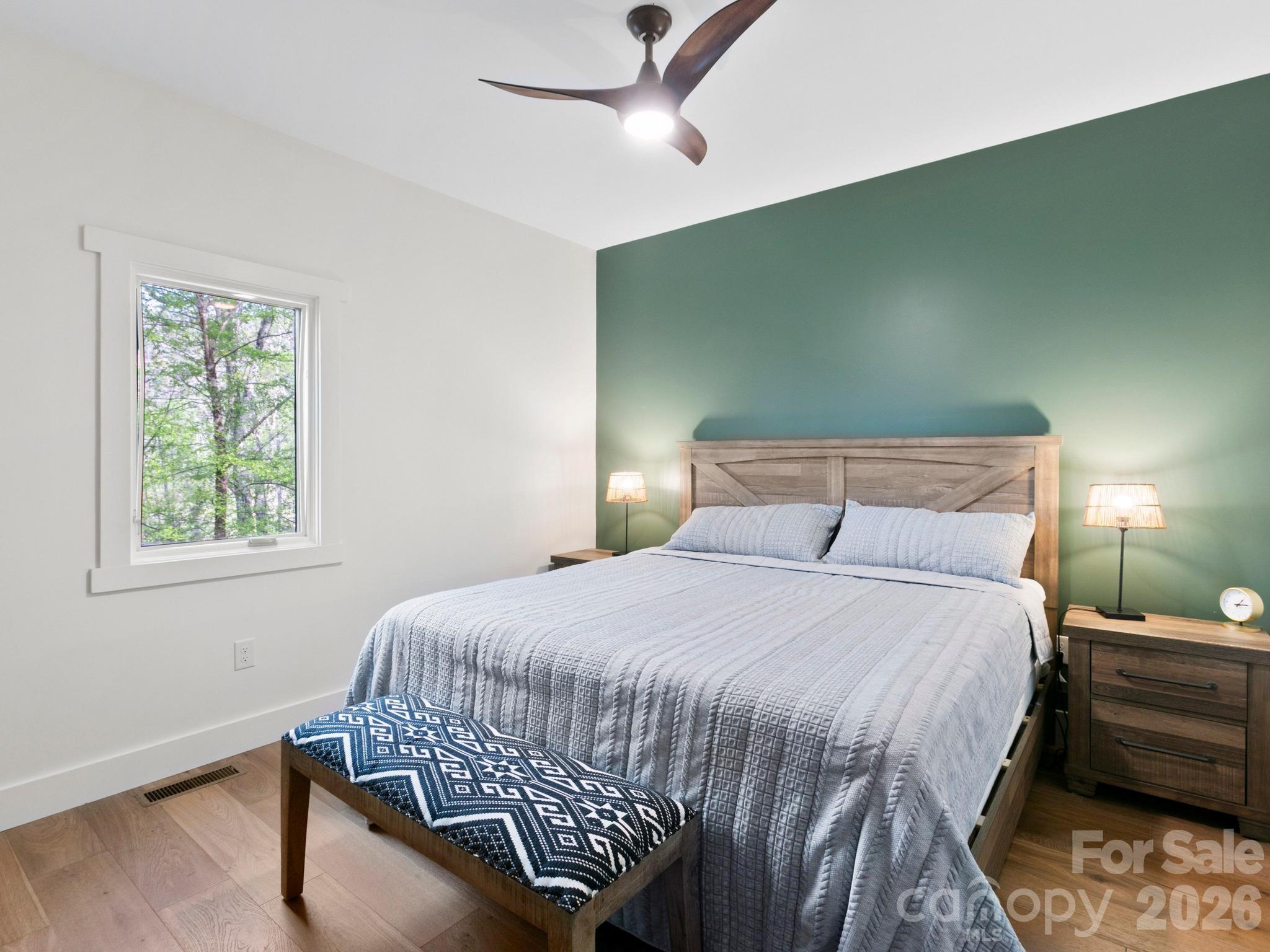 291 Webb Cove Road Asheville, NC 28804 - Photo 14 of 34 a bedroom with a bed and window
