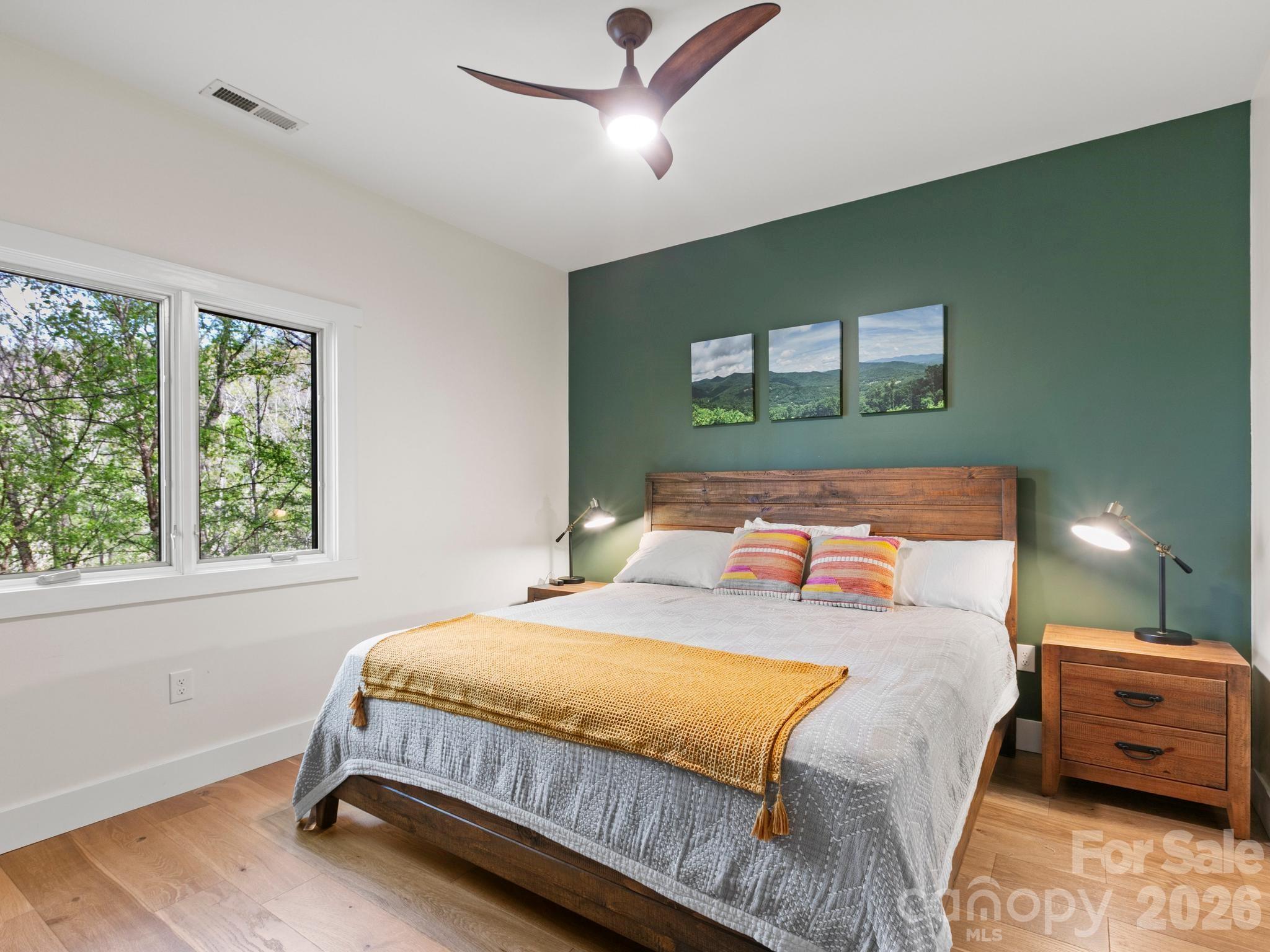 291 Webb Cove Road Asheville, NC 28804 - Photo 16 of 34 a bedroom with a bed and a window