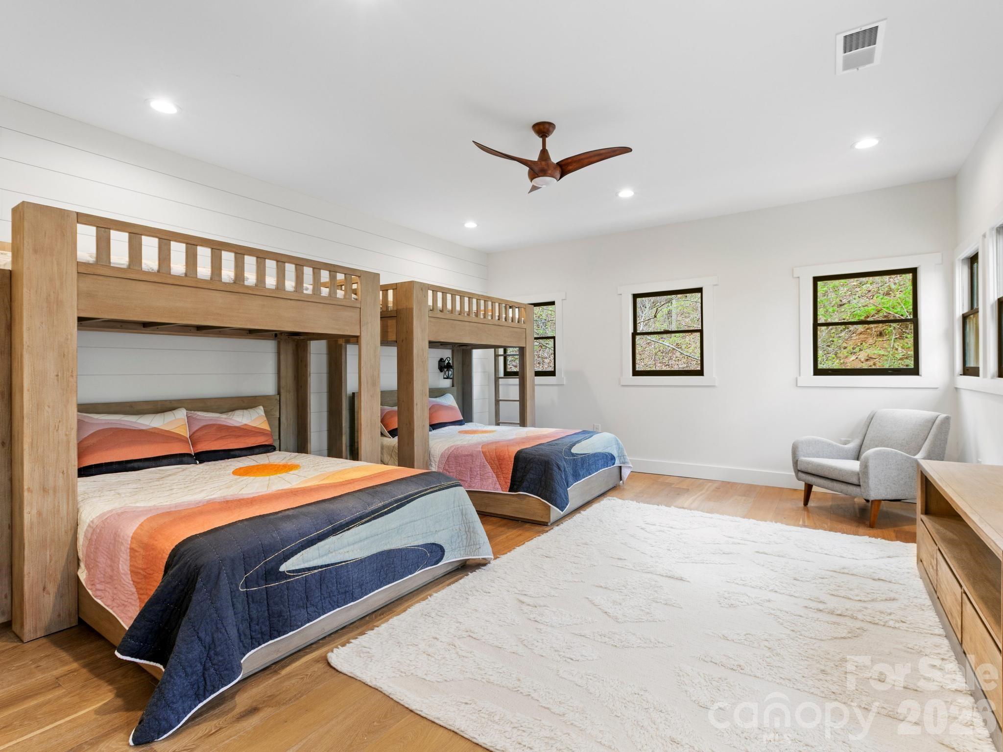 291 Webb Cove Road Asheville, NC 28804 - Photo 19 of 34 a bedroom with double bed and a large window