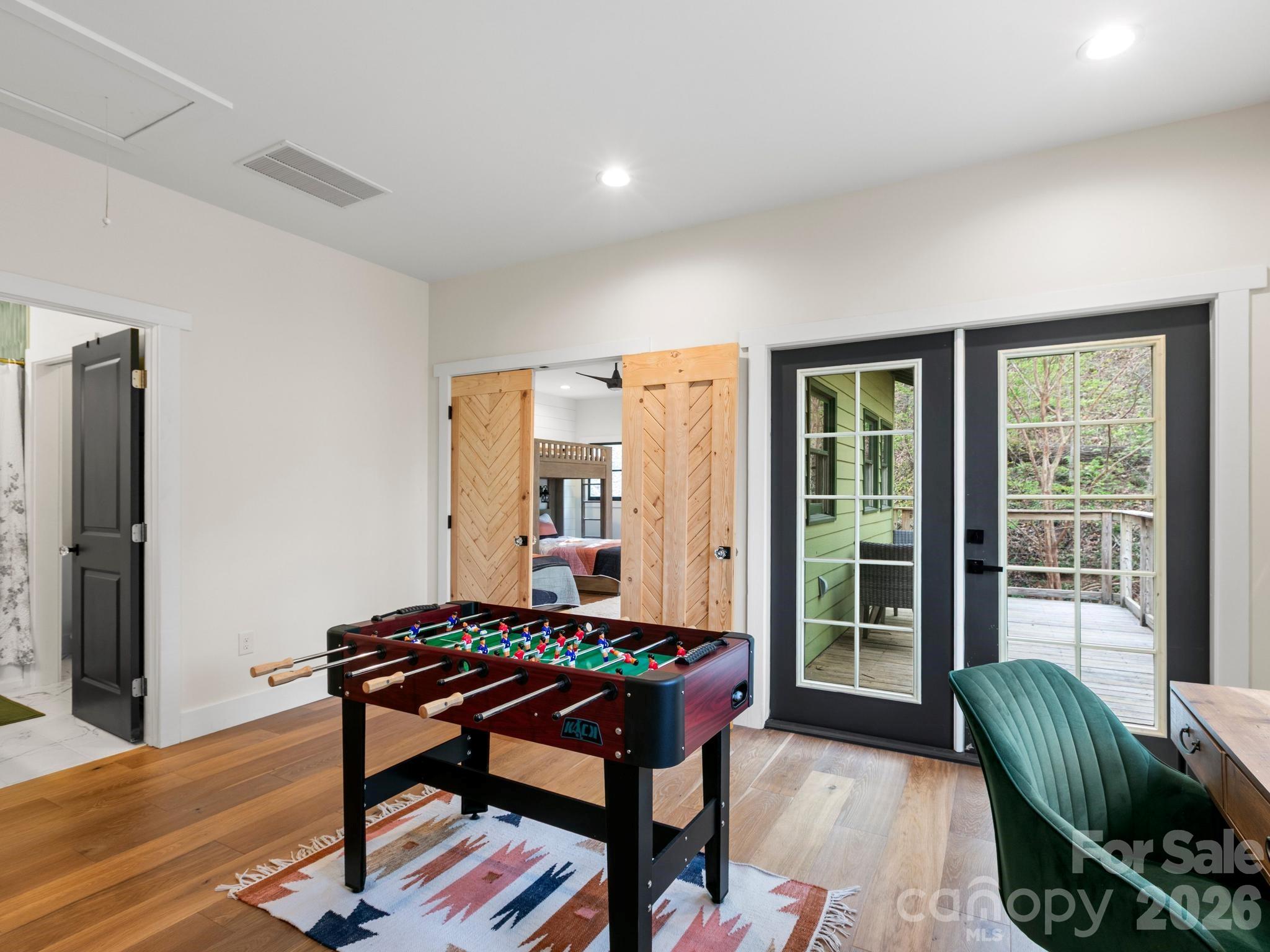 291 Webb Cove Road Asheville, NC 28804 - Photo 20 of 34 a living room with furniture and a window