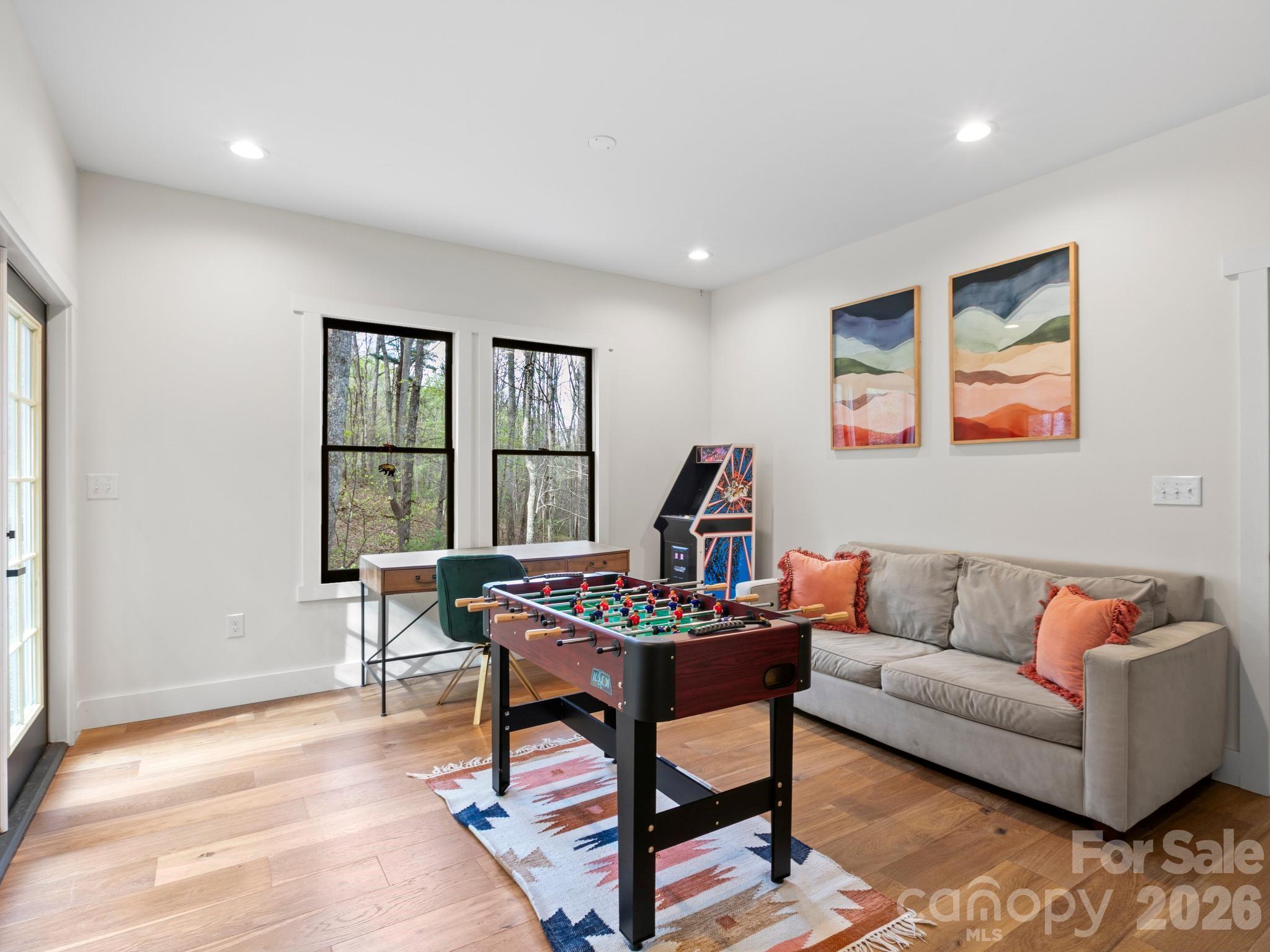 291 Webb Cove Road Asheville, NC 28804 - Photo 21 of 34 a living room with furniture and a window