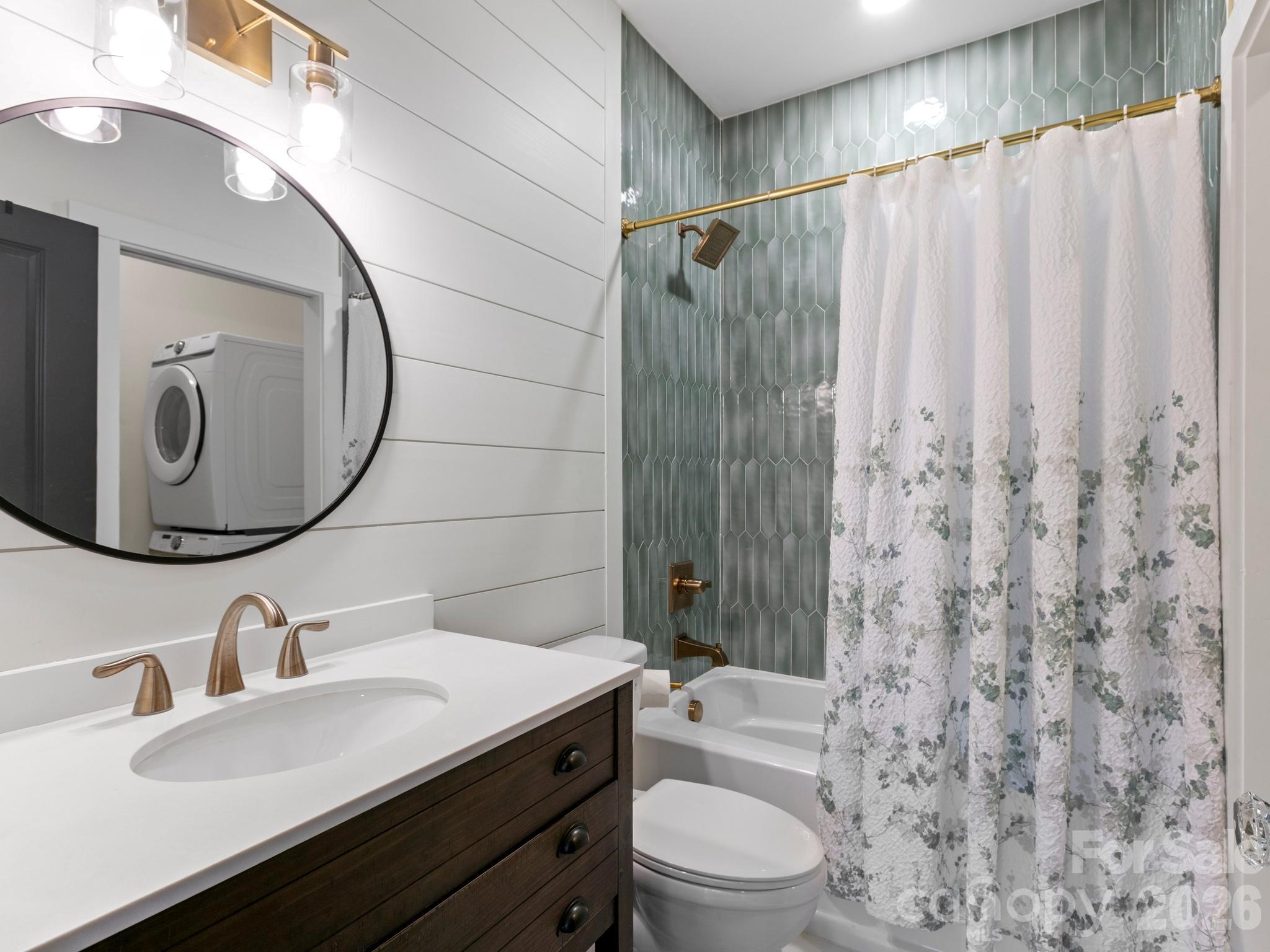 291 Webb Cove Road Asheville, NC 28804 - Photo 22 of 34 a bathroom with a sink a toilet and shower