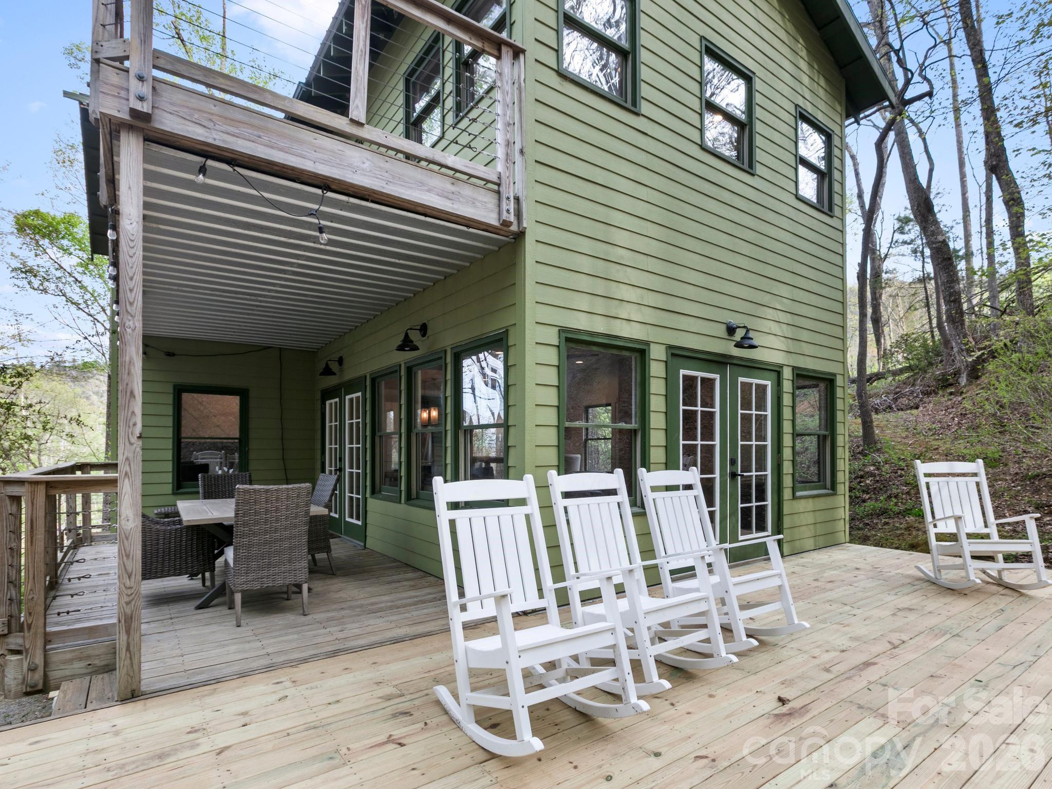 291 Webb Cove Road Asheville, NC 28804 - Photo 26 of 34 a view of a chairs and table in the patio